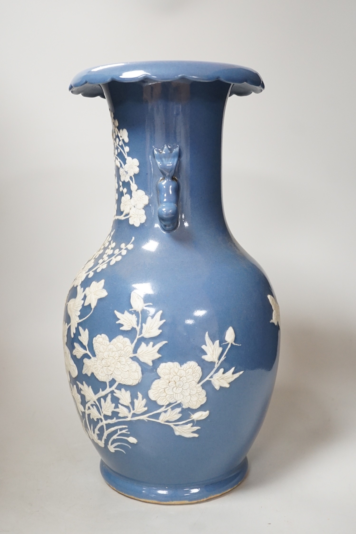 A Chinese slip-decorated blue glazed vase, 40cm